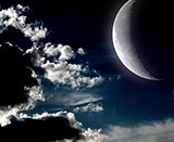The moon in the night sky in clouds "Elements of this image furnished by NASA"