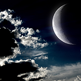 The moon in the night sky in clouds "Elements of this image furnished by NASA"